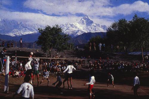 Volleyball game being played against the background of the majestic Fish Tail Mountain, 2nd National Games, Pokhara