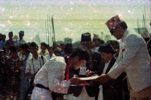 Patron of the National Sports Council HRH Prince Dhirendra awarding medal/certificate to Taekwondo player during the 3rd National Games, Birgunj