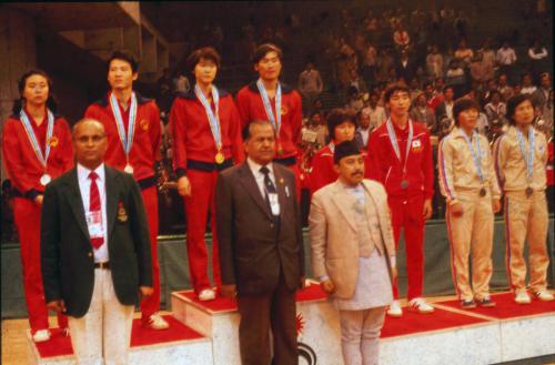 President of Nepal Olympic Committee Sharad Chandra Shaha (right) during the medal distribution ceremony during the Delhi Asian Games